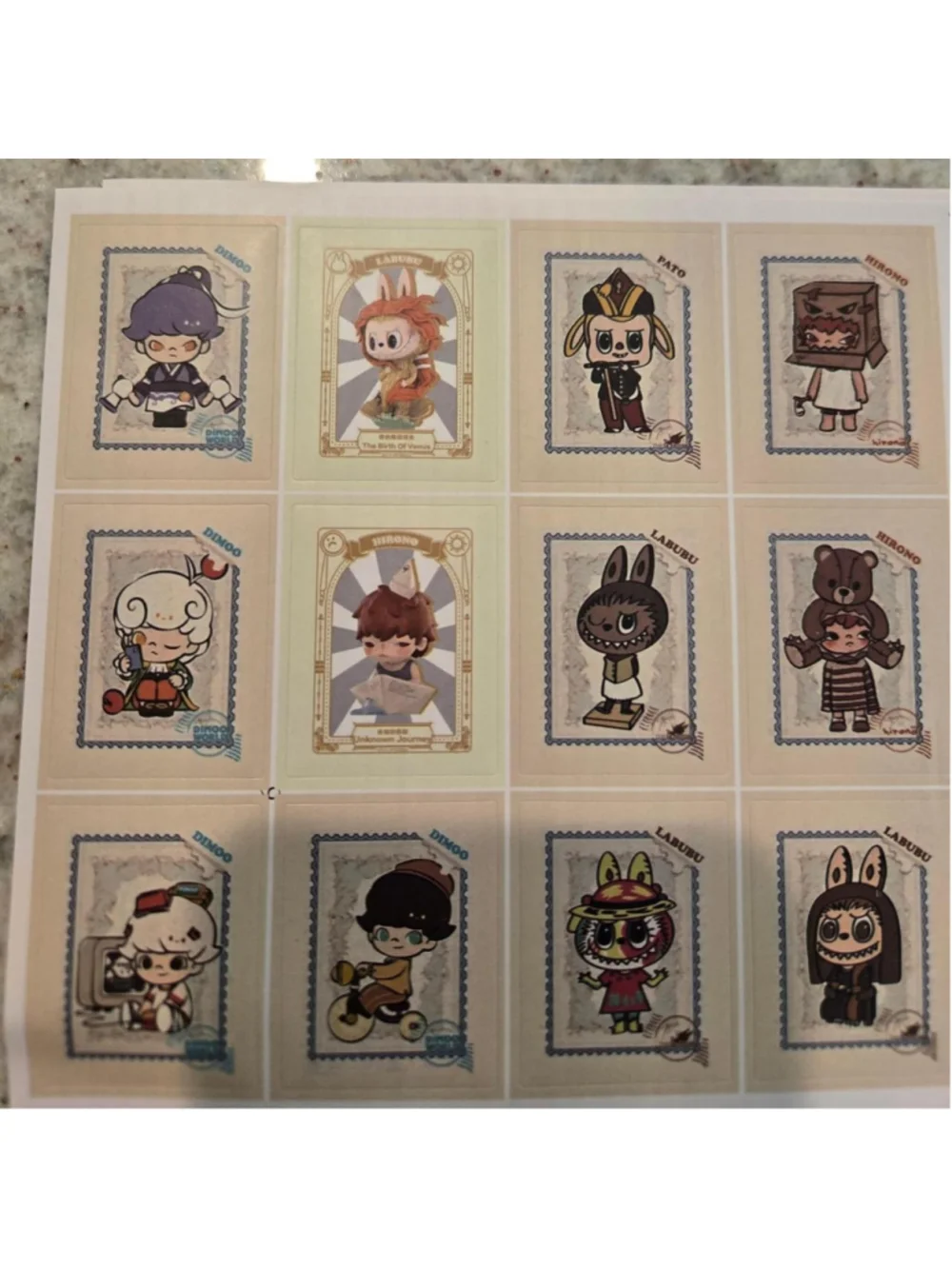 6 sticker sheets that are size 5 in by 5 in - pop mart characters